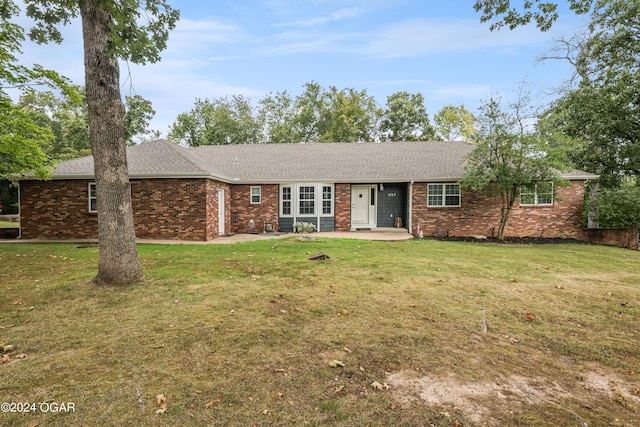 ranch-style home with a patio area and a front yard