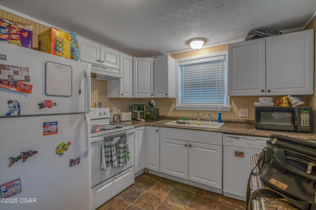 615 E 15th St, Joplin, MO 64801 - kitchen with white appliances, white cabinets, and a sink