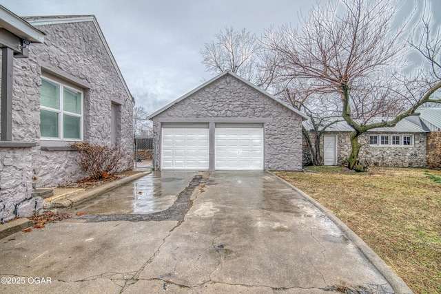 615 E 15th St, Joplin, MO 64801 - exterior space featuring a garage and a lawn