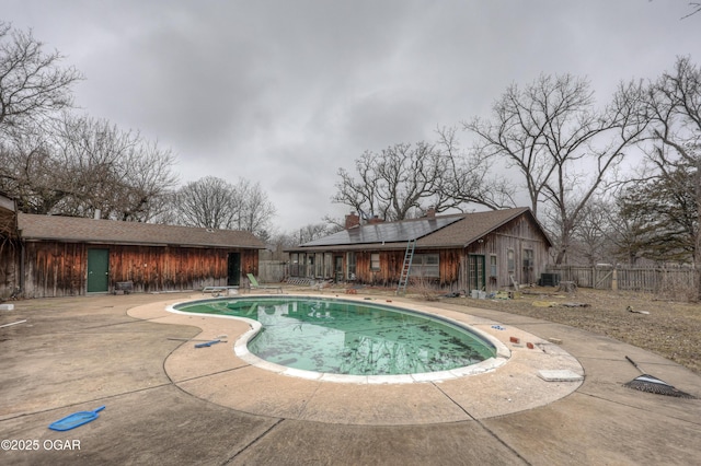 view of pool with a patio, a diving board, and central air condition unit