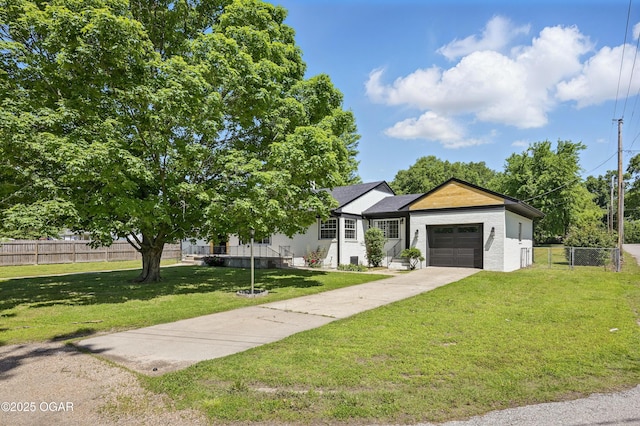 540 E 4th St, Baxter Springs, KS 66713 - view of front of house with a garage and driveway