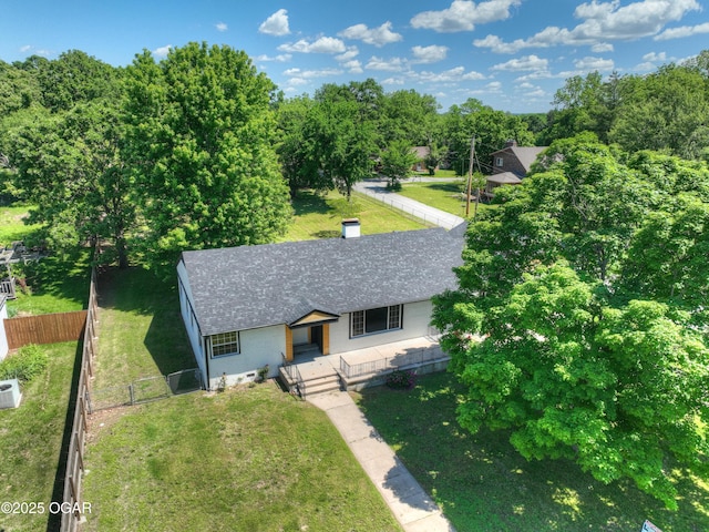 540 E 4th St, Baxter Springs, KS 66713 - view of front facade featuring a shingled roof, covered porch, and brick siding