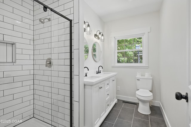 540 E 4th St, Baxter Springs, KS 66713 - full bathroom featuring tile patterned flooring, a shower stall, toilet, double vanity, and baseboards