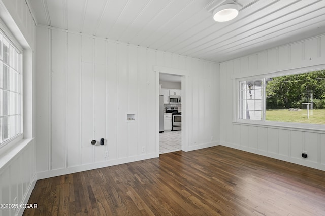 540 E 4th St, Baxter Springs, KS 66713 - unfurnished room with dark wood finished floors and a decorative wall