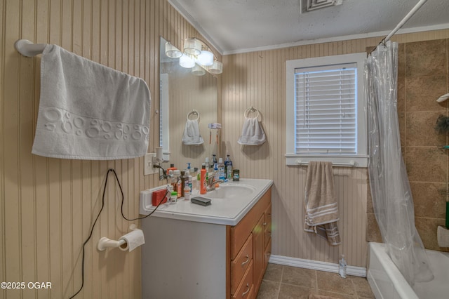 bathroom featuring tile patterned flooring, vanity, shower / bath combination with curtain, and a textured ceiling