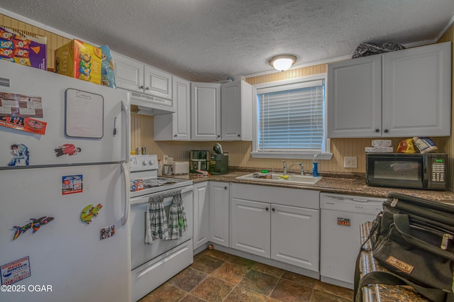 kitchen featuring white cabinetry, sink, and white appliances