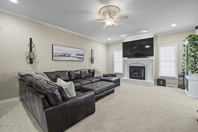 carpeted living room with crown molding and ceiling fan