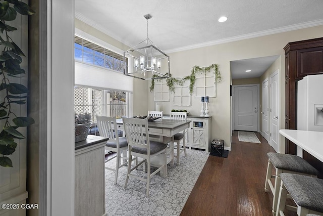 dining space with crown molding, a notable chandelier, and dark hardwood / wood-style flooring