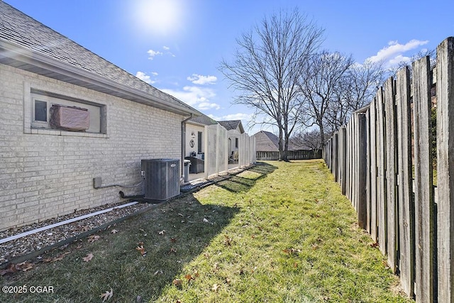 view of yard with central air condition unit