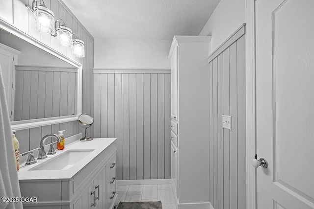 bathroom featuring vanity and a textured ceiling