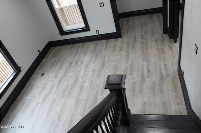 staircase featuring wood-type flooring