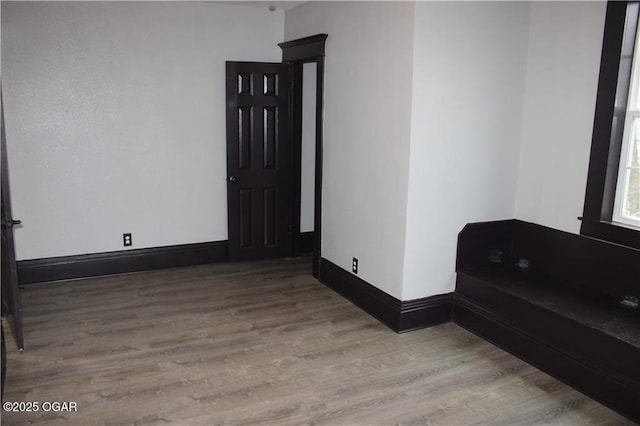 unfurnished room with light hardwood / wood-style flooring