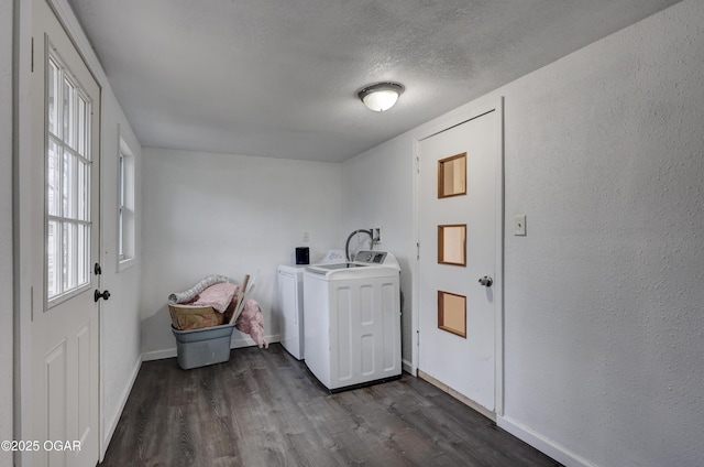 laundry area with washer and dryer, dark hardwood / wood-style floors, and a textured ceiling