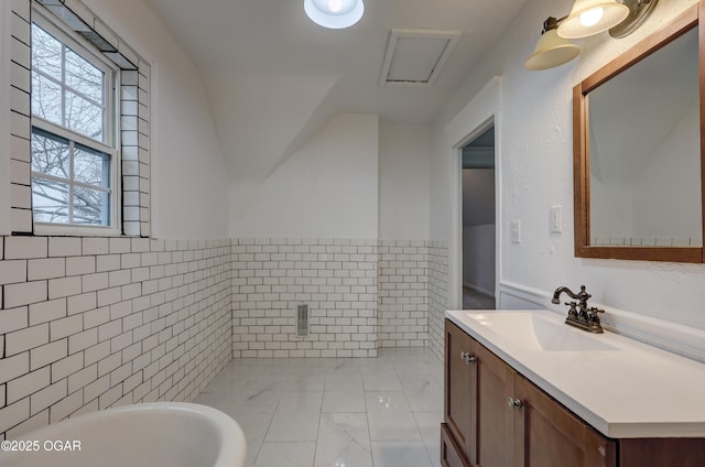 bathroom with tile walls and vanity