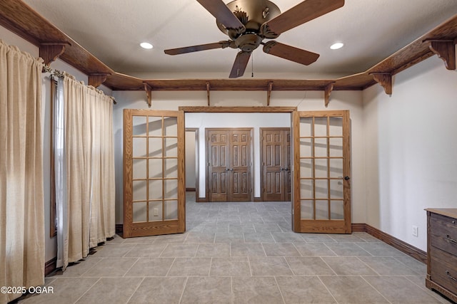 interior space featuring french doors and ceiling fan