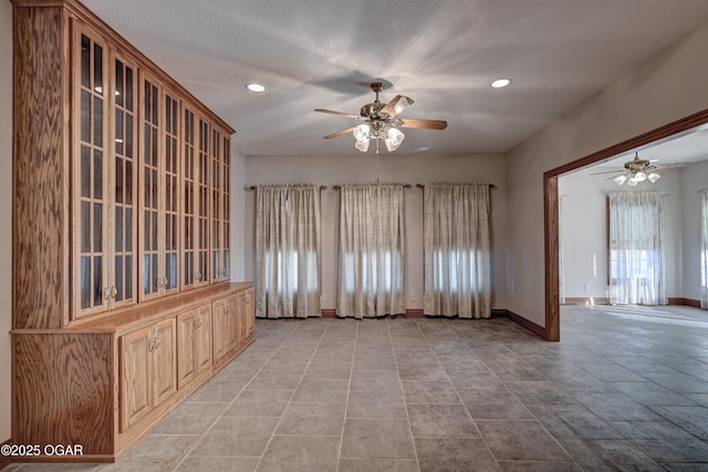 interior space featuring ceiling fan