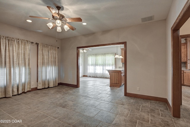 spare room with ceiling fan