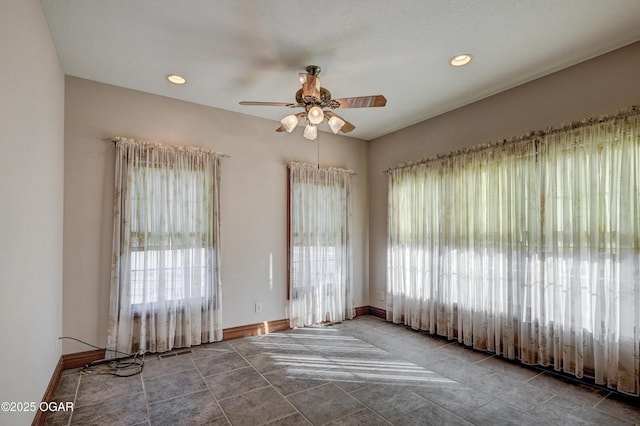 unfurnished room with ceiling fan