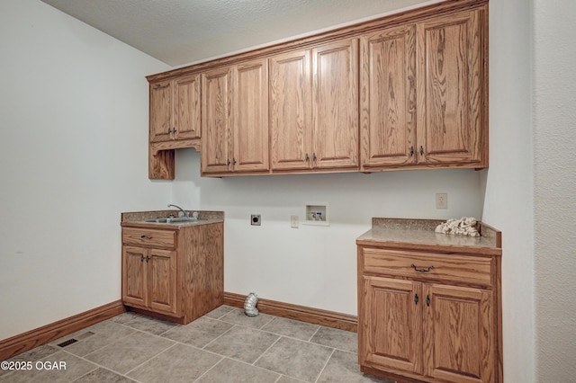 laundry room featuring cabinets, washer hookup, hookup for an electric dryer, and sink