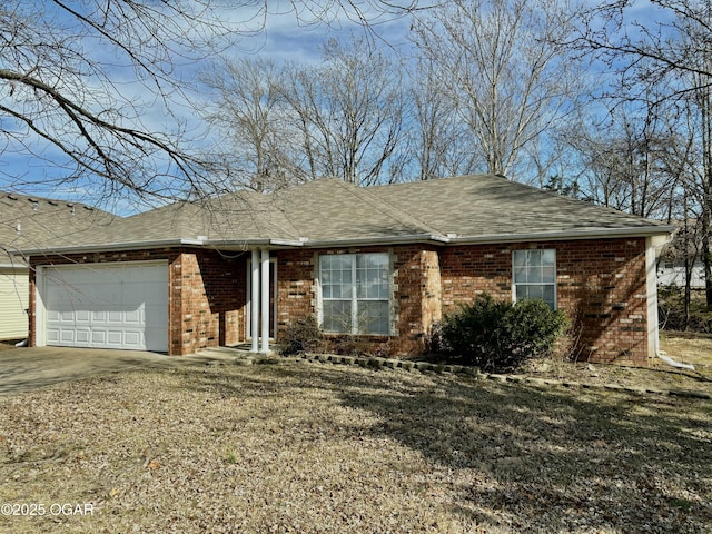 single story home featuring a garage and a front yard