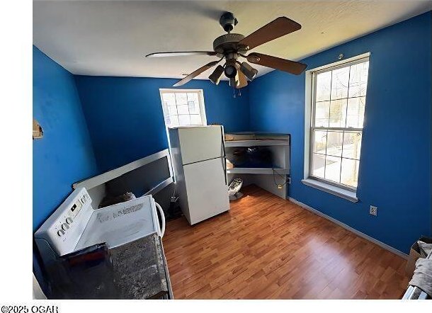 office area featuring wood finished floors and a ceiling fan