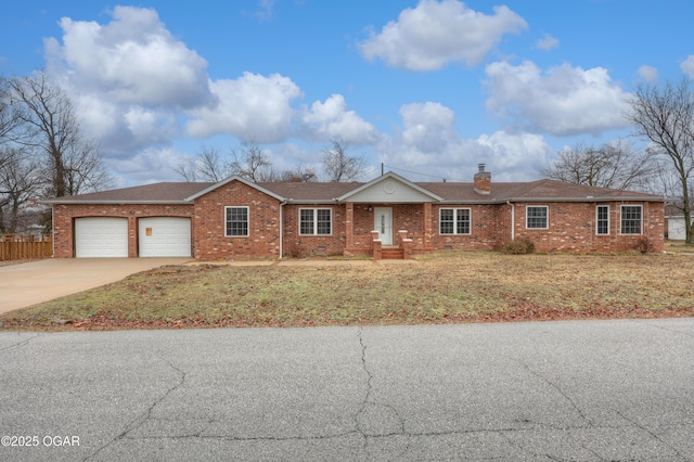 ranch-style house with a garage and a front yard