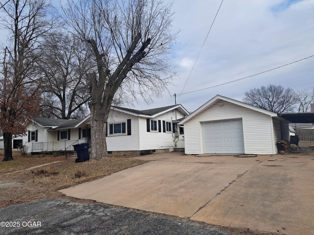 ranch-style house featuring a garage