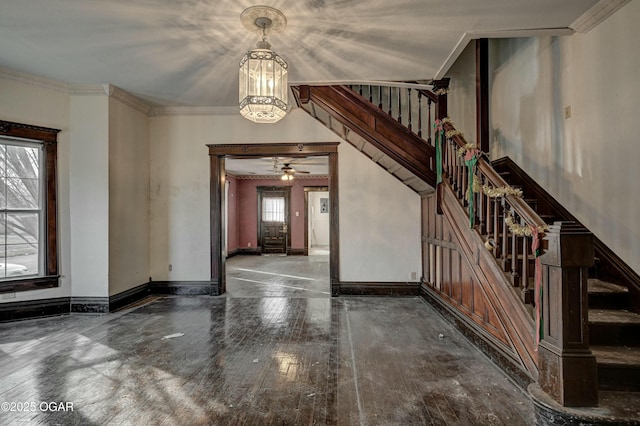 foyer entrance featuring crown molding and hardwood / wood-style floors