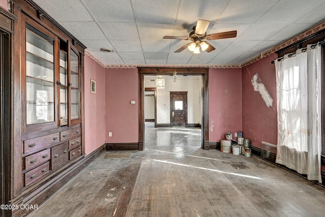 spare room featuring wood-type flooring, a paneled ceiling, and ceiling fan