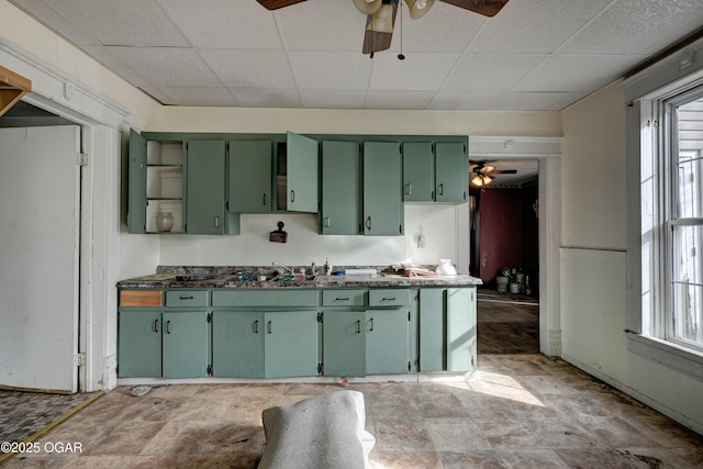 kitchen featuring a paneled ceiling, a wealth of natural light, and green cabinetry