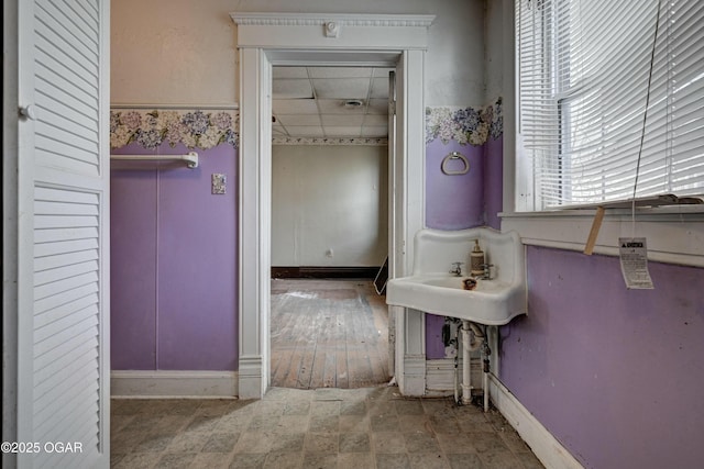 bathroom featuring sink and a paneled ceiling