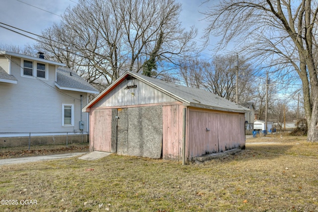 view of outbuilding featuring a lawn