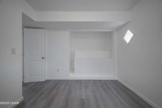 empty room with light hardwood / wood-style flooring