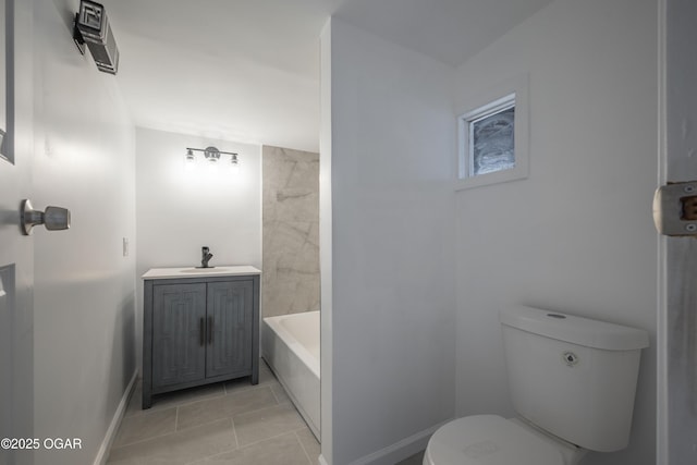 bathroom with a tub to relax in, toilet, and sink