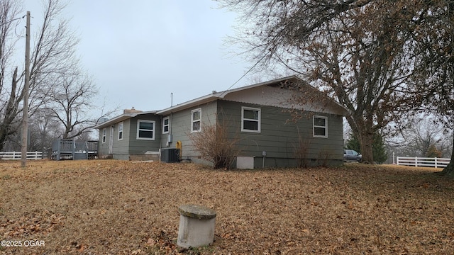 rear view of property featuring cooling unit