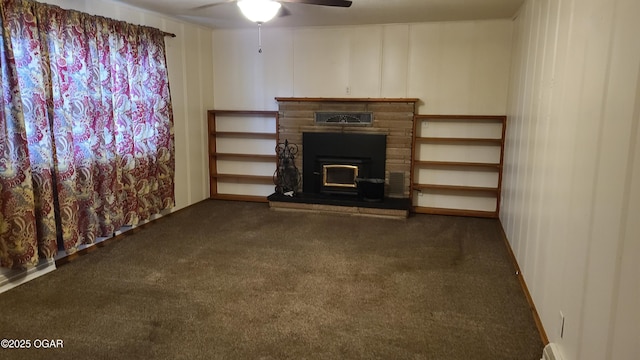 unfurnished living room with dark colored carpet, ceiling fan, and baseboard heating