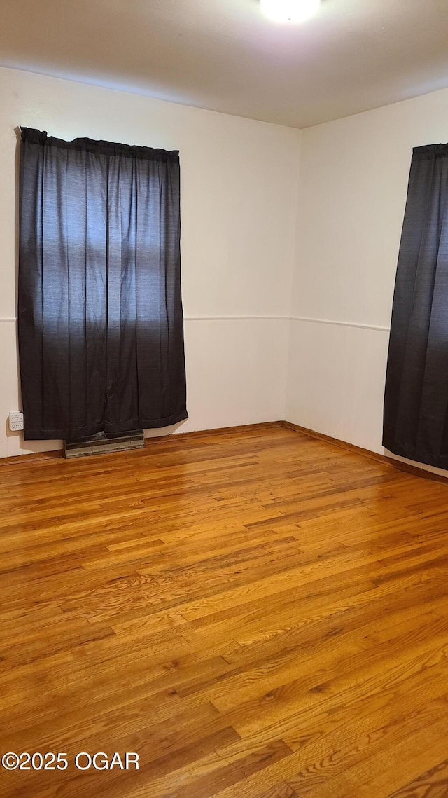 unfurnished room featuring light wood-type flooring