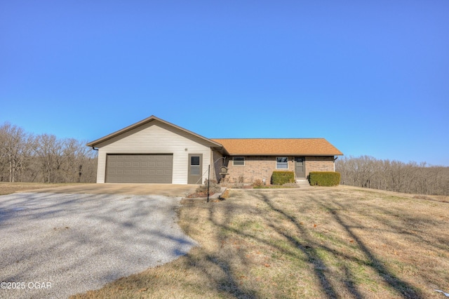 ranch-style house featuring a garage