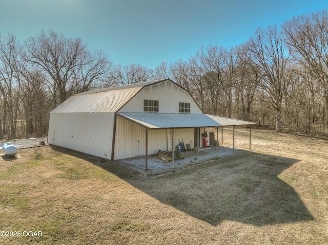 view of outbuilding with a lawn