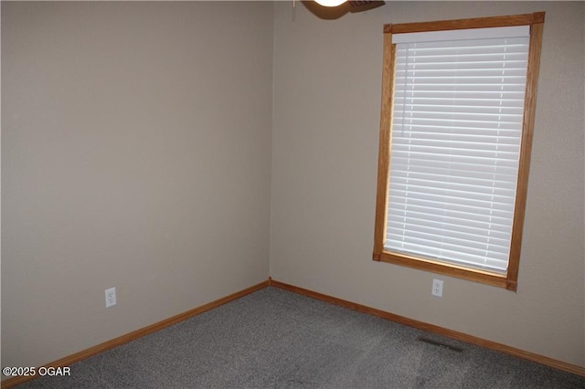 spare room featuring carpet flooring