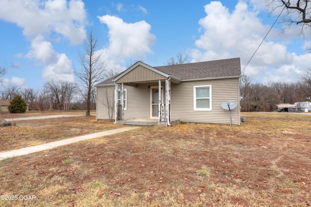 view of front of home featuring a porch and a front lawn