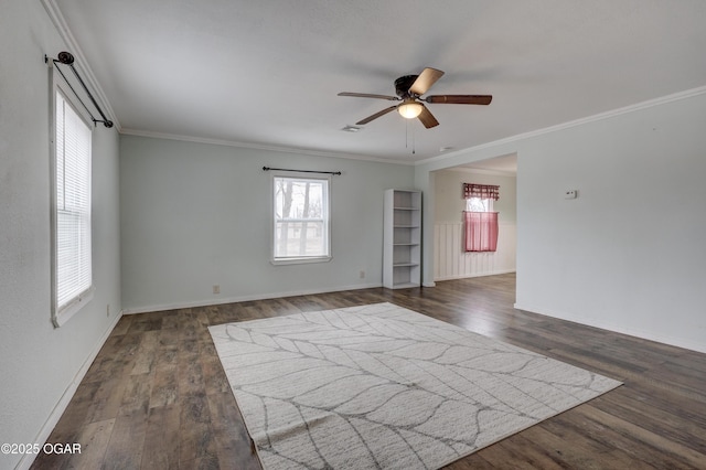 unfurnished room featuring baseboards, crown molding, a ceiling fan, and dark wood-style flooring