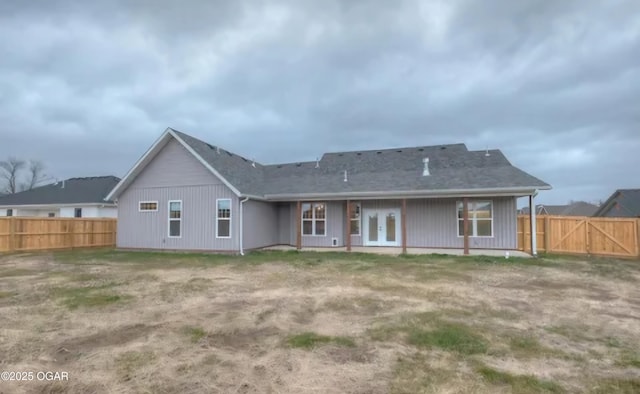 back of property featuring french doors