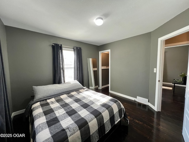 bedroom featuring dark hardwood / wood-style floors