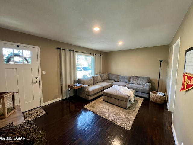 living room with dark hardwood / wood-style floors