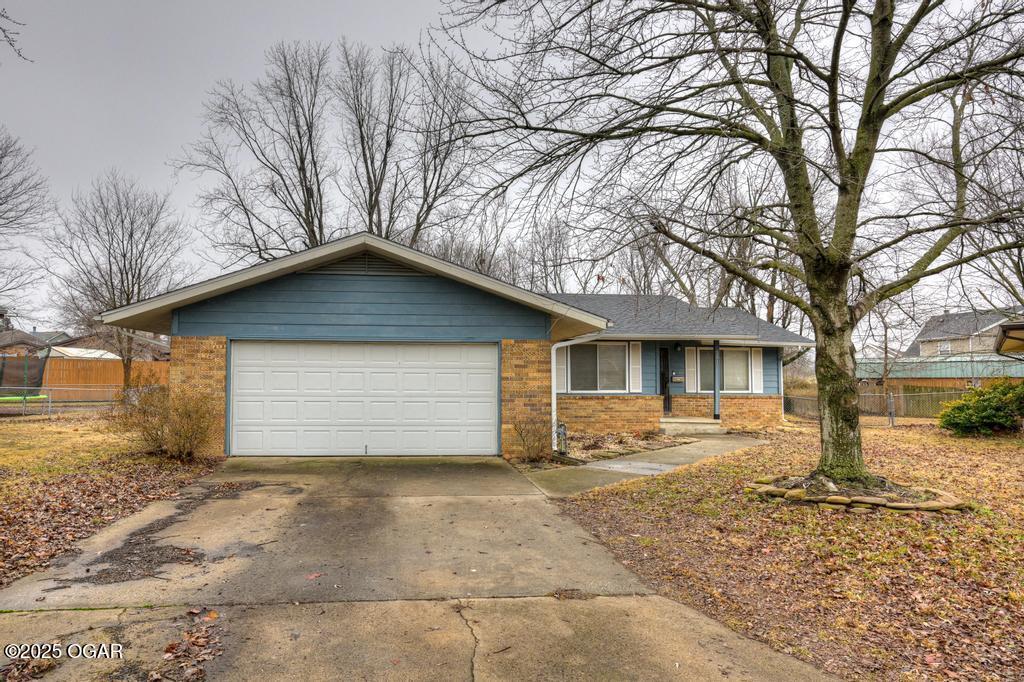 single story home with a garage