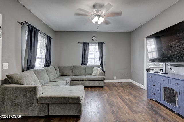 living room with ceiling fan and dark hardwood / wood-style flooring