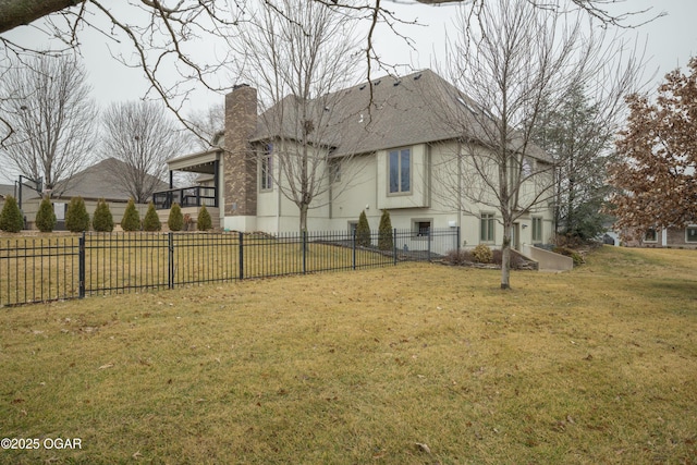 view of side of property featuring a yard