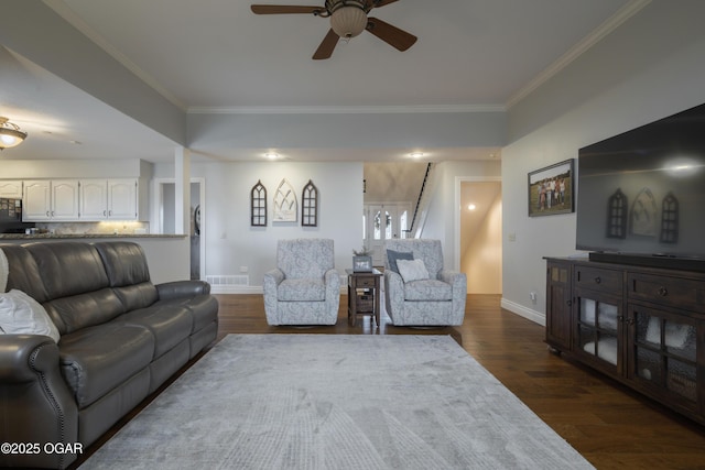 living room featuring ornamental molding and dark hardwood / wood-style floors