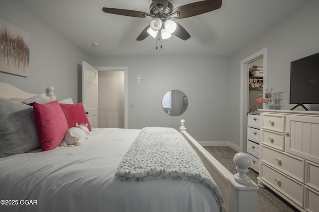 bedroom featuring dark colored carpet and ceiling fan